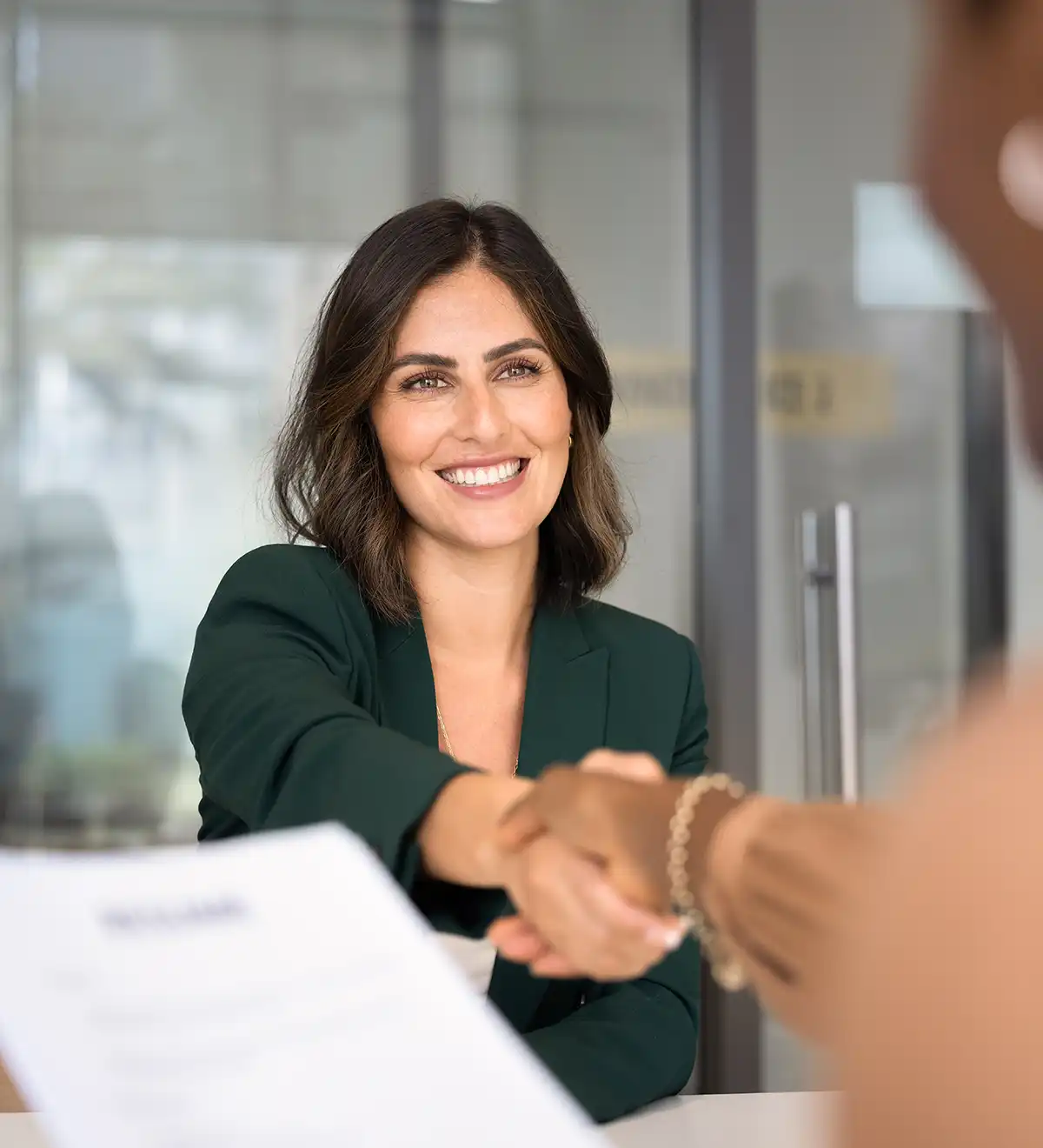HR professional welcoming new employee onboard.