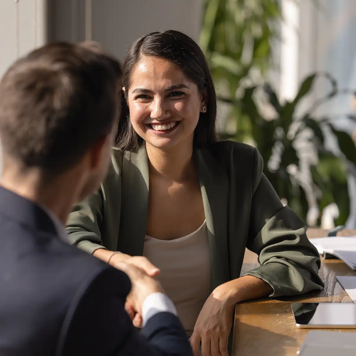 business professional woman shaking hands with legal consultant