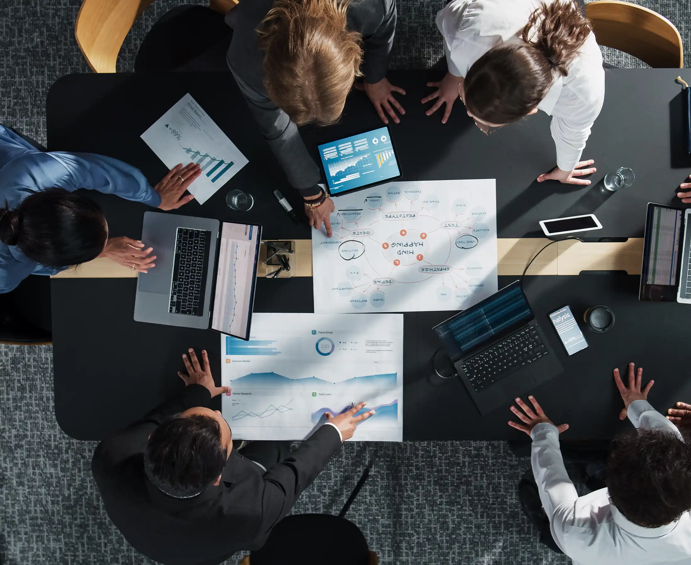 Diverse Professionals Working on Business Statistics Reports
